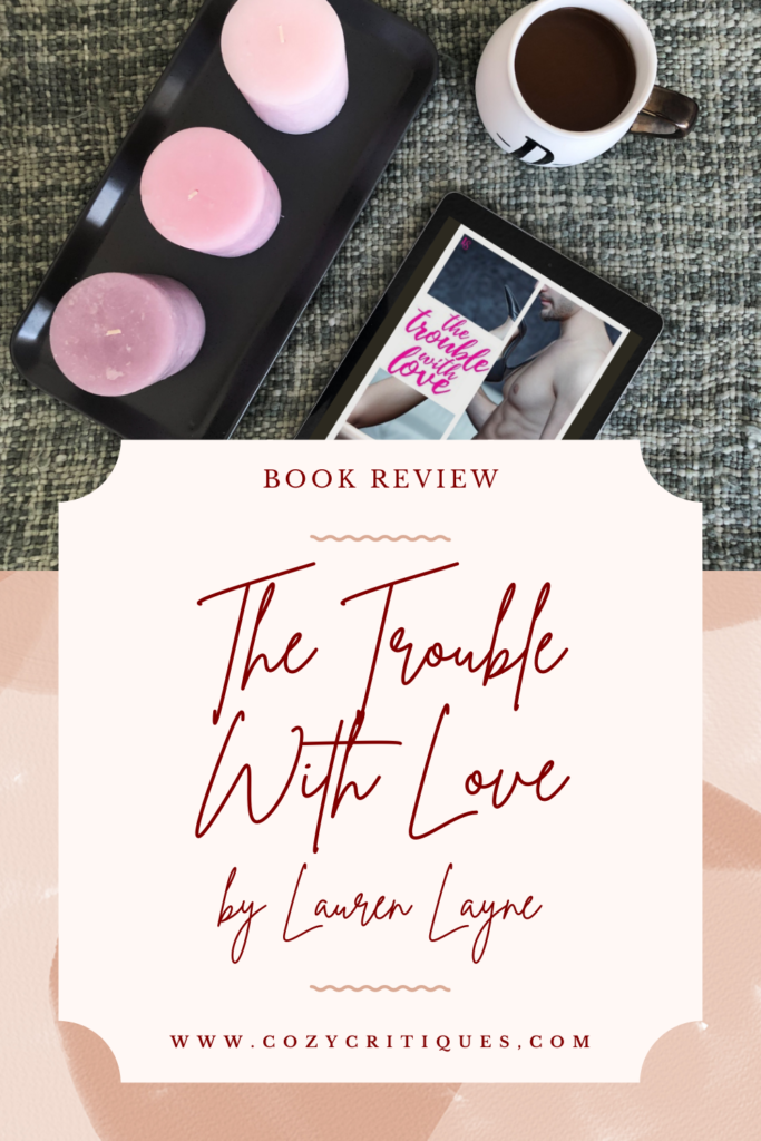 Pinable image with the text: Book Review The Trouble With Love by Lauren Layne www.CozyCritiques.com
